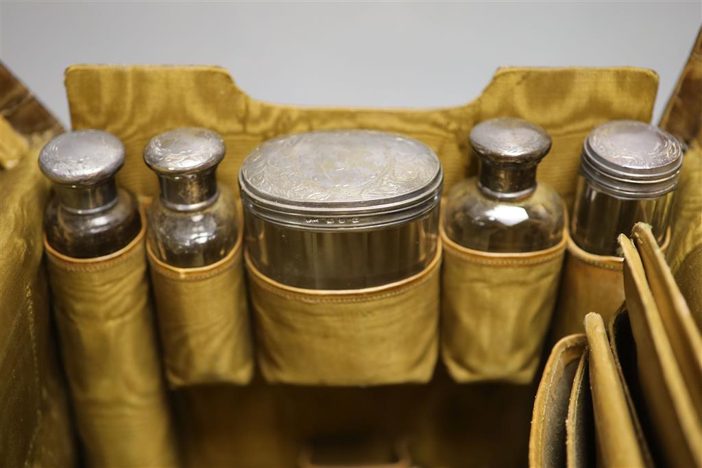 A late Victorian crocodile skin travelling toilet case